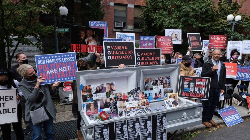 FILE - In this Oct. 18, 2020. file photo, families of COVID-19 victims who passed away in New York nursing homes gather in front of the Cobble Hill Heath Center to demand that New York Gov. Andrew Cuomo apologize for his response to the coronavirus i
