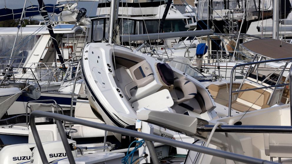 Boats are piled on each other at the Southport Marina following the effects of Hurricane Isaias in Southport, N.C., Tuesday, Aug. 4, 2020. (AP Photo/Gerry Broome)