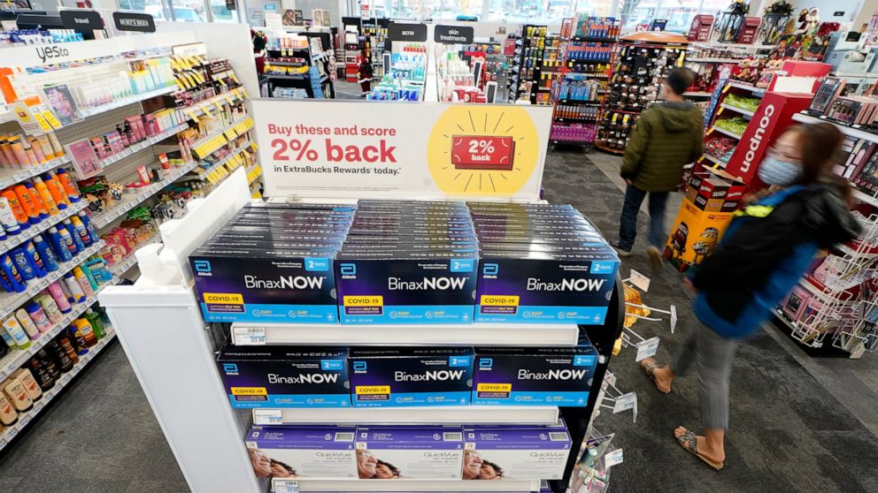 Boxes of BinaxNow home COVID-19 tests made by Abbott and QuickVue home tests made by Quidel are shown for sale Monday, Nov. 15, 2021, at a CVS store in Lakewood, Wash., south of Seattle. After weeks of shortages, retailers like CVS say they now have 