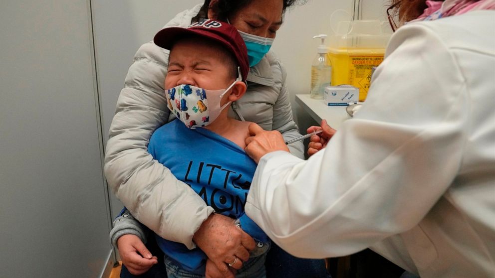 FILE - A boy receives a dose of China's Sinovac COVID-19 coronavirus vaccine at a community vaccination center in Hong Kong on Feb. 25, 2022. U.S. government advisers met Wednesday, June 15, 2022 to decide whether to endorse COVID-19 shots for babies