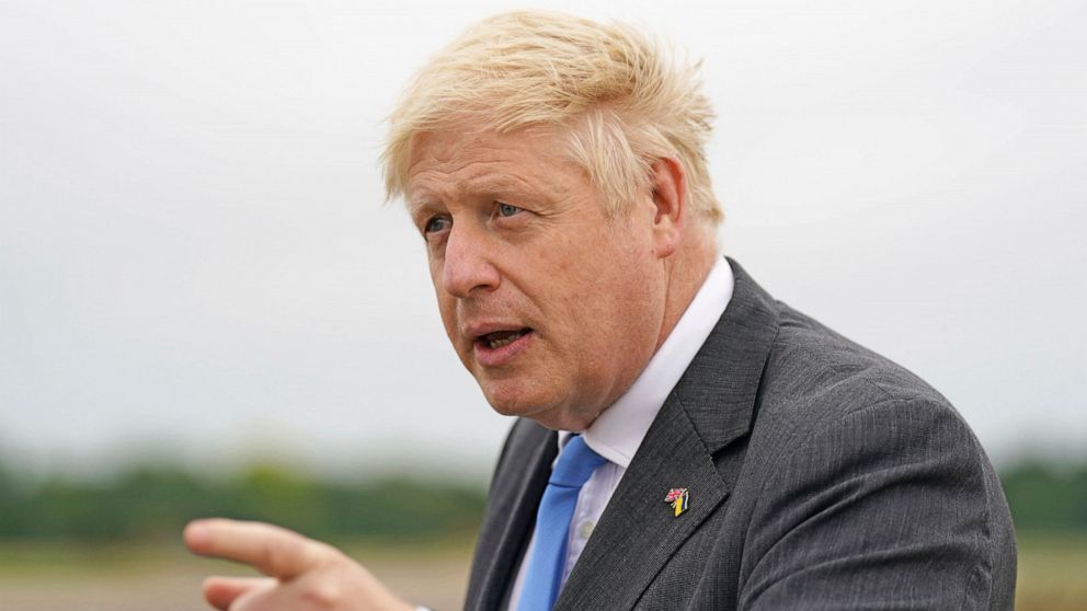 Britain's Prime Minister Boris Johnson gestures after arriving at RAF Brize Norton, in Oxfordshire, England, Saturday, June 18, 2022, following a trip to Ukraine. Johnson met with President Volodymyr Zelenskyy in Kyiv to offer continued aid and milit