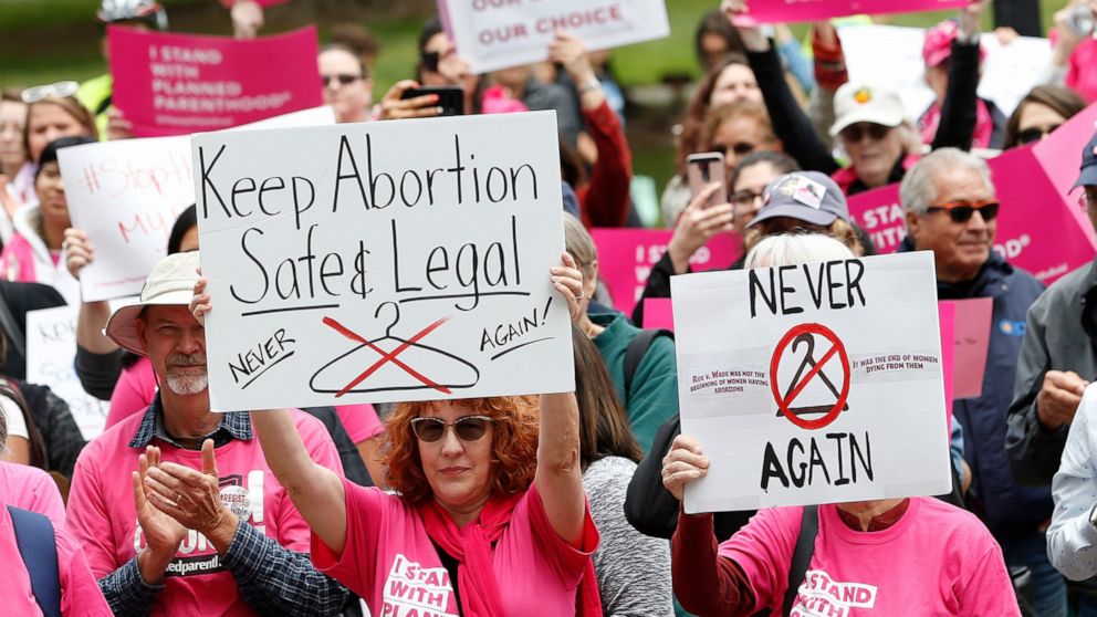 FILE - In this May 21, 2019, file photo, People gather at the state Capitol to rally in support of abortion rights in Sacramento, Calif. The Trump administration has agreed to postpone implementing a rule allowing medical workers to decline performin
