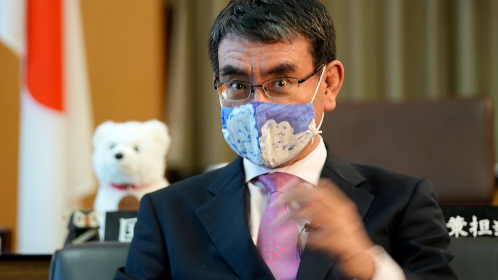 AP Interview: Japan minister urges young to get vaccinated