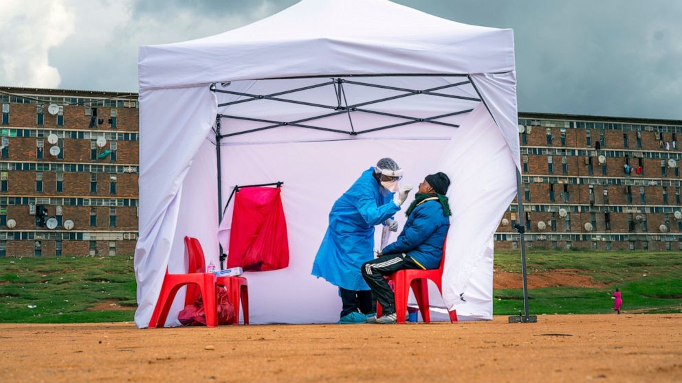 A residents from the Alexandra township gets tested for COVID-19 , in Johannesburg, Wednesday, April 29, 2020. South Africa will begin a phased easing of its strict lockdown measures on May 1, although confirmed cases of coronavirus continue to incre