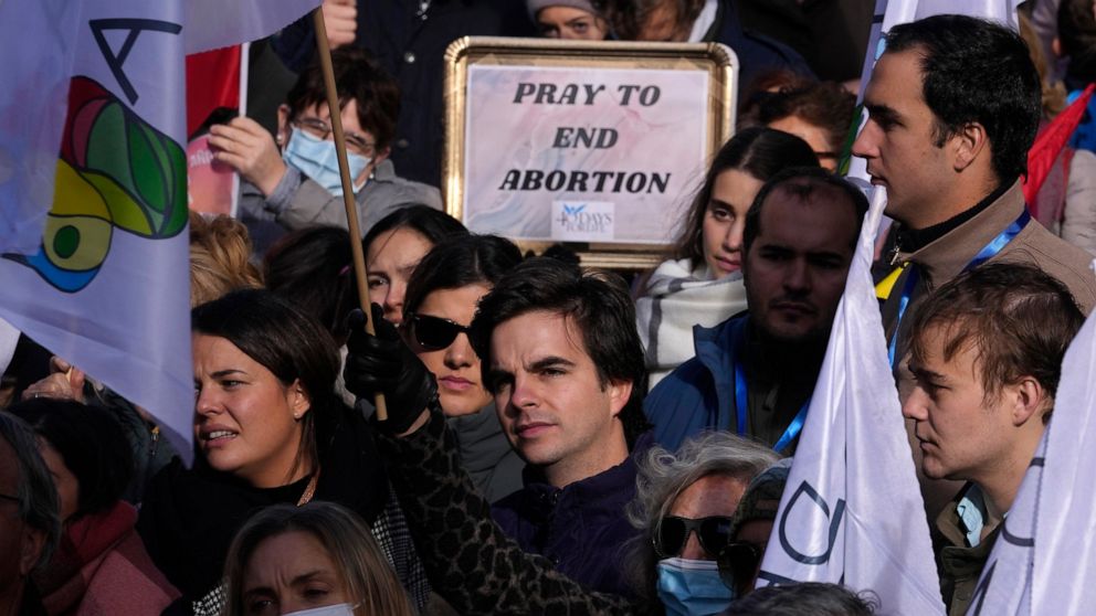 FILE - People take part in a protest against abortion and euthanasia in Madrid, Spain, Sunday, Nov. 28, 2021. The Spanish government approved May 17, 2022 a draft bill that widens abortion rights for teenagers and may make Spain the first country in 