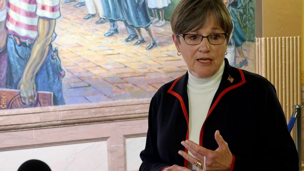 Kansas Gov. Laura Kelly answers questions from reporters about the coronavirus pandemic after a meeting with legislative leaders, Thursday, July 2, 2020, at the Statehouse in Topeka, Kan. Kelly has issued an order to require people to wear masks in p