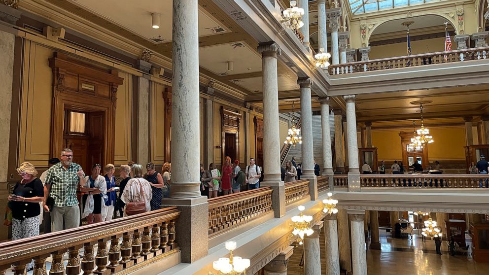 People line up outside the Indiana House chamber in Indianapolis, Tuesday, Aug. 2, 2022, ahead of its morning session to hear testimony on the Senate-approved abortion ban now in consideration by the House. (AP Photo/Arleigh Rodgers)