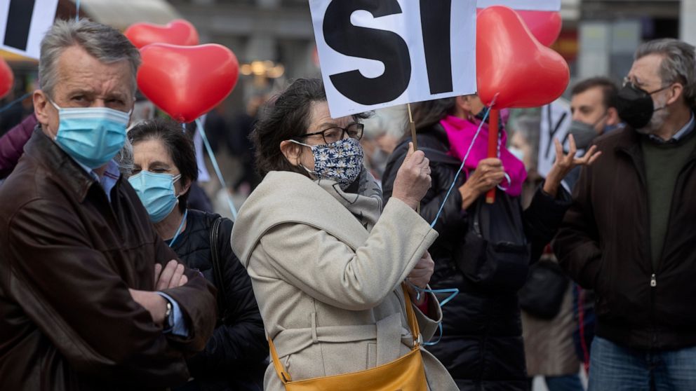 Pro euthanasia protesters demonstrate in Madrid, Spain, Thursday, March 18, 2021. Spain has become the seventh country in the world and fourth in Europe to allow physician-assisted suicide and euthanasia for long-suffering patients of incurable disea