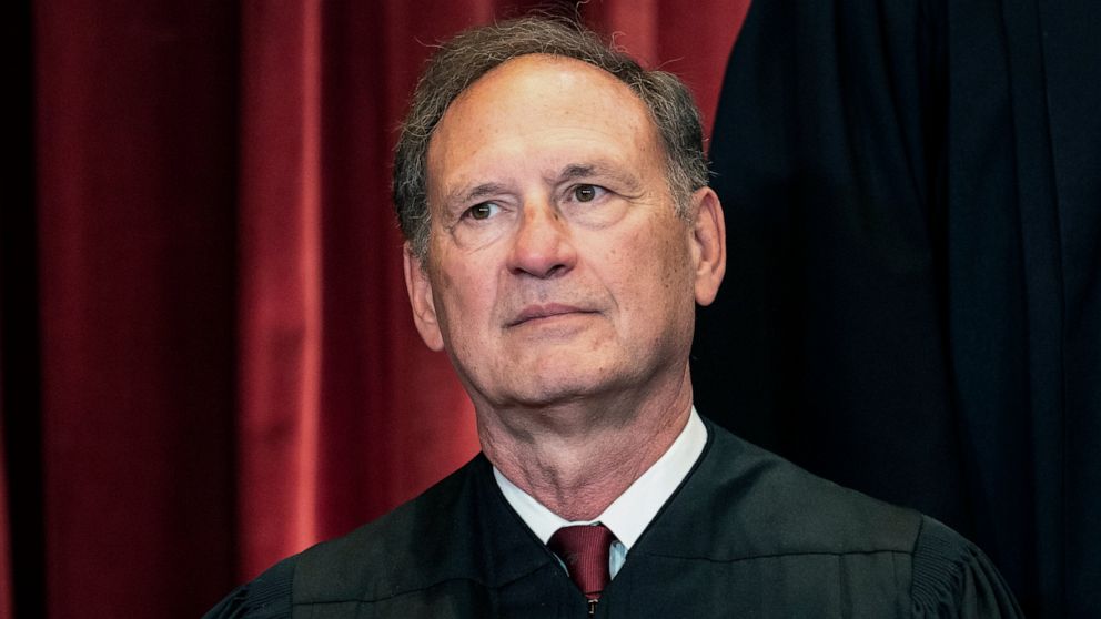 FILE - Associate Justice Samuel Alito sits during a group photo at the Supreme Court in Washington, April 23, 2021. The Supreme Court has ended constitutional protections for abortion that had been in place nearly 50 years — a decision by its conserv