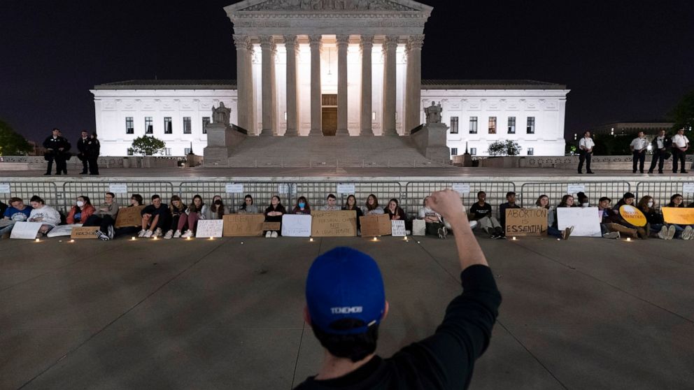 A crowd of people gather outside the Supreme Court early Tuesday, May 3, 2022, in Washington. A draft opinion suggests the U.S. Supreme Court could be poised to overturn the landmark 1973 Roe v. Wade case that legalized abortion nationwide, according