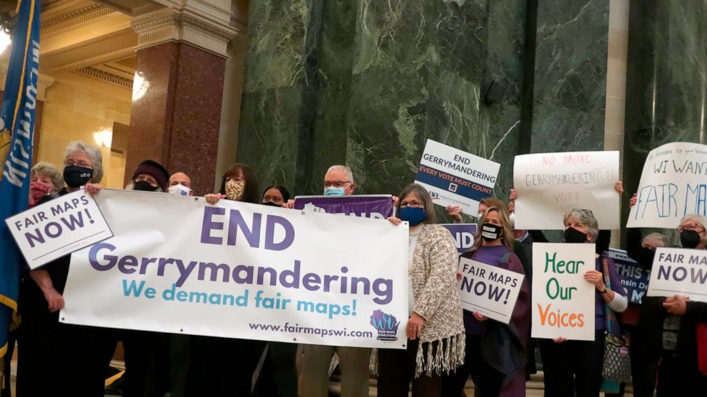 FILE - More than 100 opponents of the Republican redistricting plans vow to fight the maps at a rally ahead of a joint legislative committee hearing at the Wisconsin state Capitol in Madison, Wis., on Thursday, Oct. 28, 2021. In overturning a half-ce