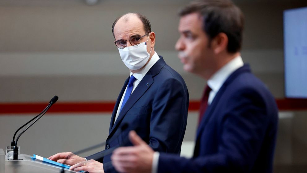 French Prime Minister Jean Castex, left, looks on as French Health Minister Olivier Veran speaks during a press conference in Paris, Thursday, Jan. 14, 2021. Trying to fend off the need for a third nationwide lockdown that would further dent Europe's