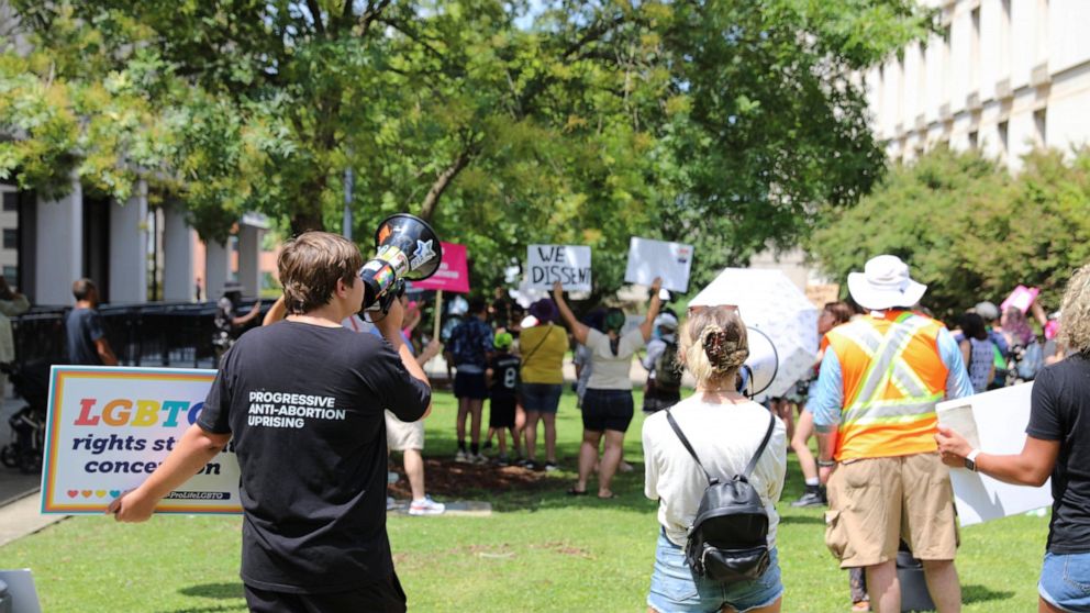 Protesters who want stricter abortion laws in South Carolina face protesters who want fewer restrictions before a House committee considering an abortion bill met on Tuesday, July 19, 2022, in Columbia, S.C. (AP Photo/Jeffrey Collins)