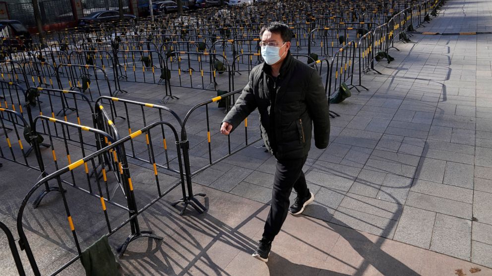 Beijing seals off more residential areas, reports 12 cases