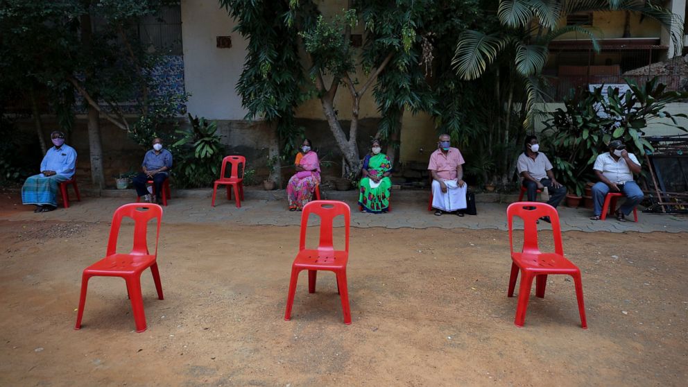 The Latest: South Korea mulls dropping masks for vaccinated