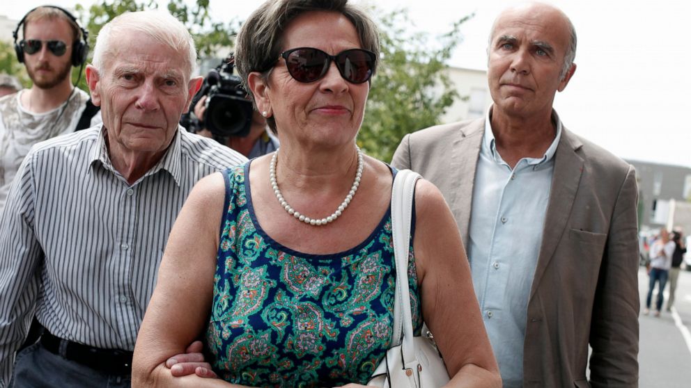 FILE - In this July 23, 2015 file photo, Viviane and Pierre Lambert, left, parents of Vincent Lambert, arrive at the Sebastopol hospital, in Reims, eastern France, where Vincent, was on artificial life support. In a vegetative state for 11 years, Vin