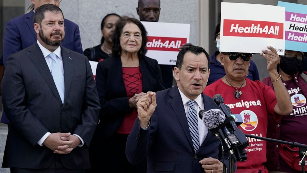 California Assembly Speaker Anthony Rendon, D-Lakewood, center, speaks in support of health care for all low-income immigrants living in the country illegally during a rally at the Capitol Sacramento, Calif., on Wednesday, June 29, 2022. Gov. Gavin N