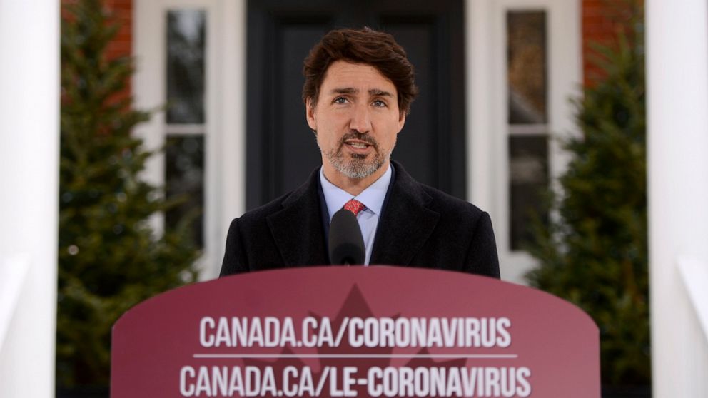 Canada's Prime Minister Justin Trudeau addresses Canadians on the coronavirus situation from Rideau Cottage in Ottawa, Ontario, on Wednesday, March 25, 2020. (Sean Kilpatrick/The Canadian Press via AP)