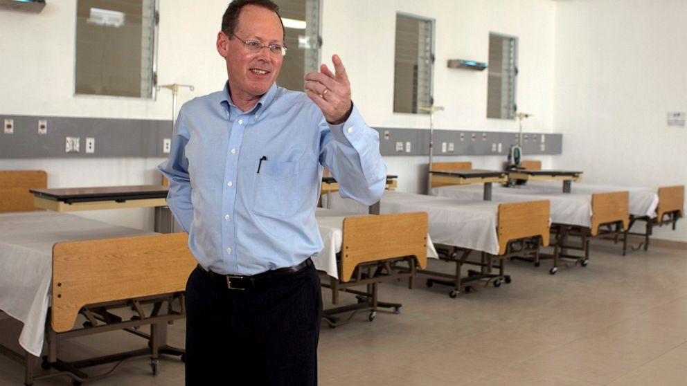 In this picture taken Jan. 10, 2012, Partners in Health's co-founder, Dr. Paul Farmer, gestures during the inauguration of national referral and teaching hospital in Mirebalais, 30 miles (48 kilometers) north of Port-au-Prince, Haiti. Dr. Paul Farmer