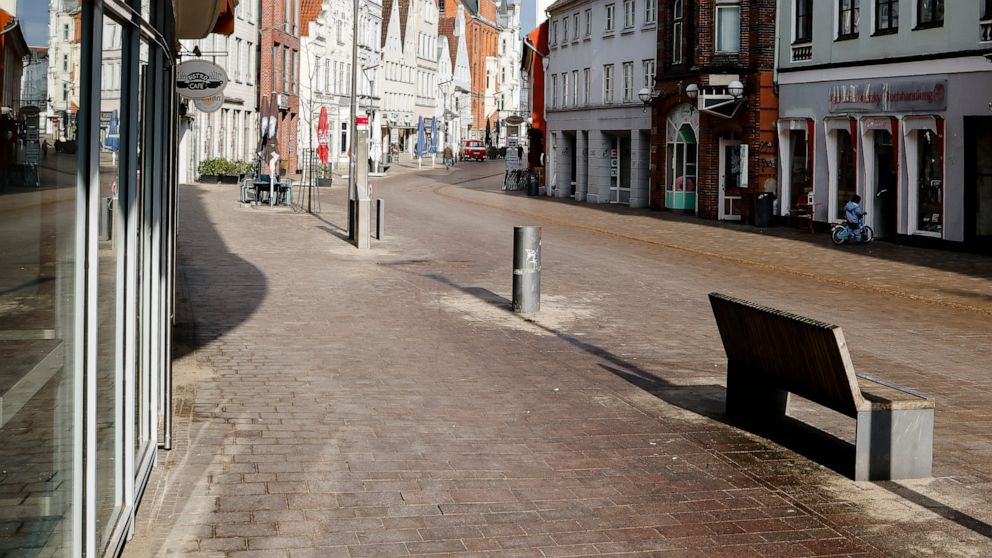 A street is deserted in the city center of Flensburg, Germany, Saturday, Feb. 20, 2021. Because of the high number of coronavirus infections in this northern German area, strickt measures take place in the city to avoid the further spread of the viru
