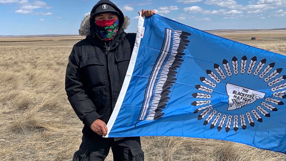 This photo from early May, 2020, provided by Angeline Cheek shows Curtis Yazzie as he demonstrates at a construction site for the XL Pipeline just inside the U.S.-Canadian border near Saco, Mont. Members of several tribes in Montana and North Dakota 