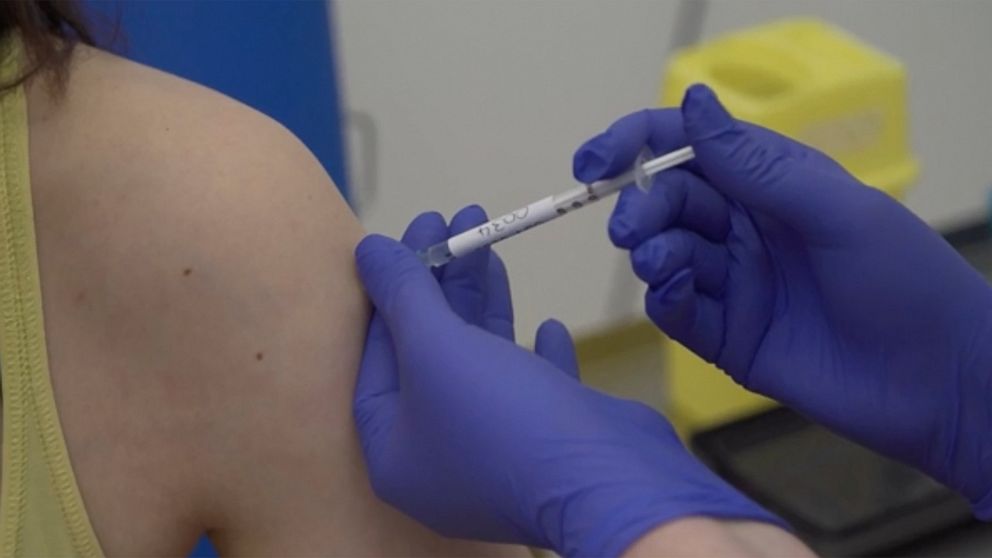 Screen grab taken from video issued by Britain's Oxford University, showing a person being injected as part of the first human trials in the UK to test a potential coronavirus vaccine, untaken by Oxford University in England, Thursday April 23, 2020.