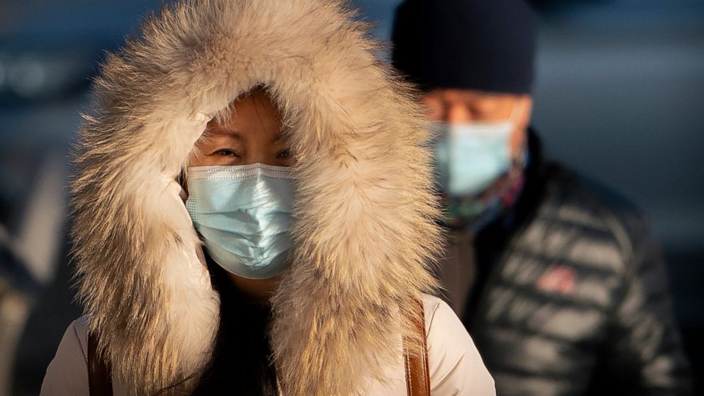 Amid virus fears, China urges employees to skip getaway travel