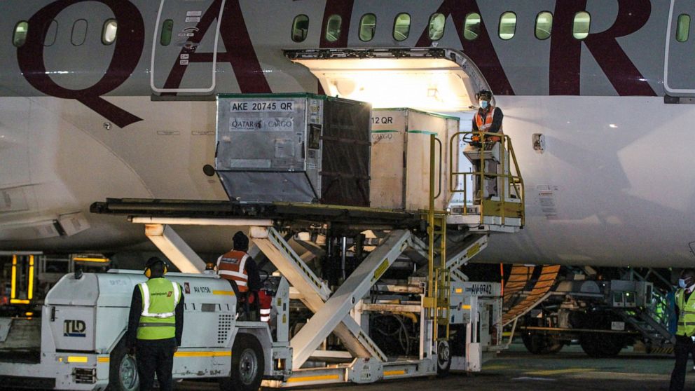 The first arrival of COVID-19 vaccines to Kenya is offloaded from a Qatar Airways flight at Jomo Kenyatta International Airport in Nairobi, Kenya, early Wednesday, March 3, 2021. Around 1.02 million doses of the AstraZeneca COVID-19 vaccine manufactu