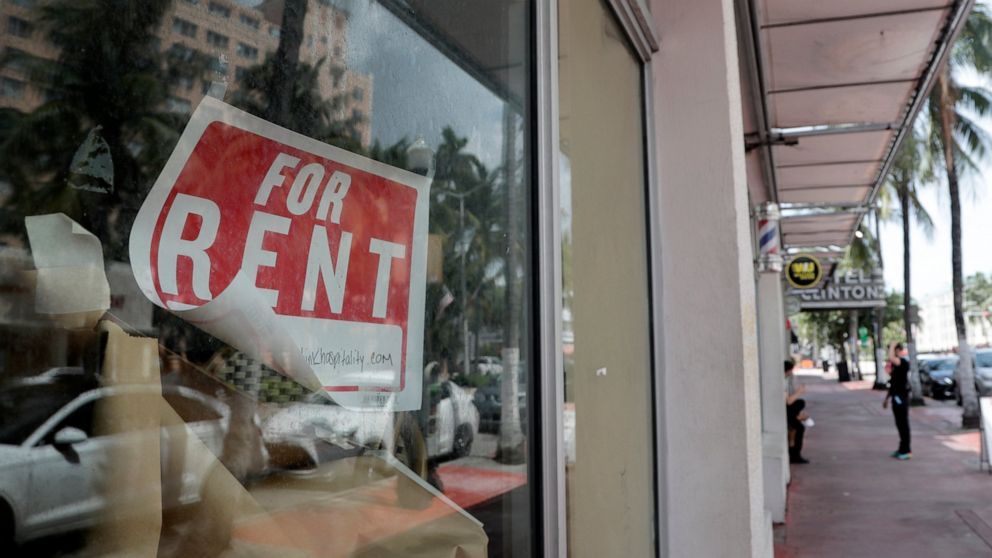 FILE - In this July 13, 2020, file photo a For Rent sign hangs on a closed shop during the coronavirus pandemic in Miami Beach, Fla. Nearly half of Americans whose families experienced layoffs during the pandemic now believe their lost jobs will not 