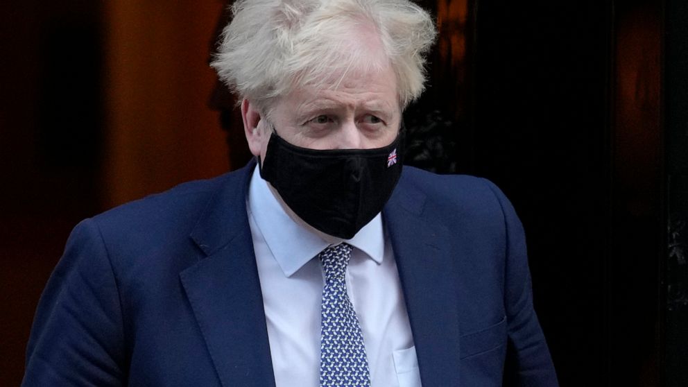 Britain's Prime Minister Boris Johnson leaves Downing Street to attend the weekly session of Prime Ministers Questions in London, Wednesday, Jan. 12, 2022. British Prime Minister Boris Johnson is facing a wave of public and political outrage over all
