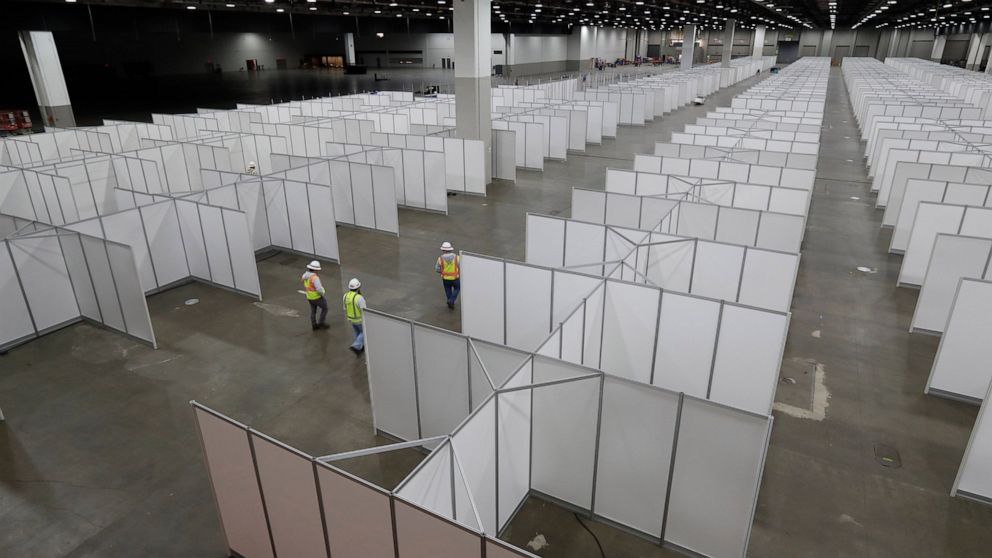In this April 1, 2020, photo the interior of the TCF Center with temporary hospital rooms is seen inside the convention center in Detroit. In the decade before Michigan and its largest city became the latest hotspot for the deadly coronavirus, offici