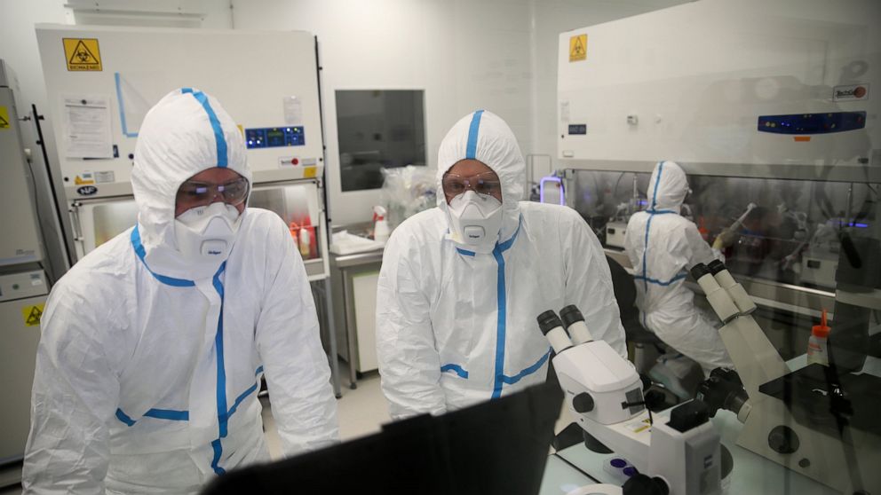 Laboratory technicians work at Valneva headquarters in Saint-Herblain, western France, Wednesday, Feb. 3, 2021. French pharmaceutical startup Valneva had big news in September: a government contract for 60 million doses of its coronavirus vaccine can
