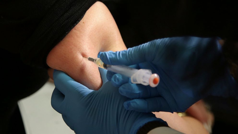 FILE - In this March 27, 2019, file photo, a woman receives a measles, mumps and rubella vaccine at the Rockland County Health Department in Pomona, N.Y. Measles cases in the U.S. this year have climbed to the highest level in 25 years, according to 