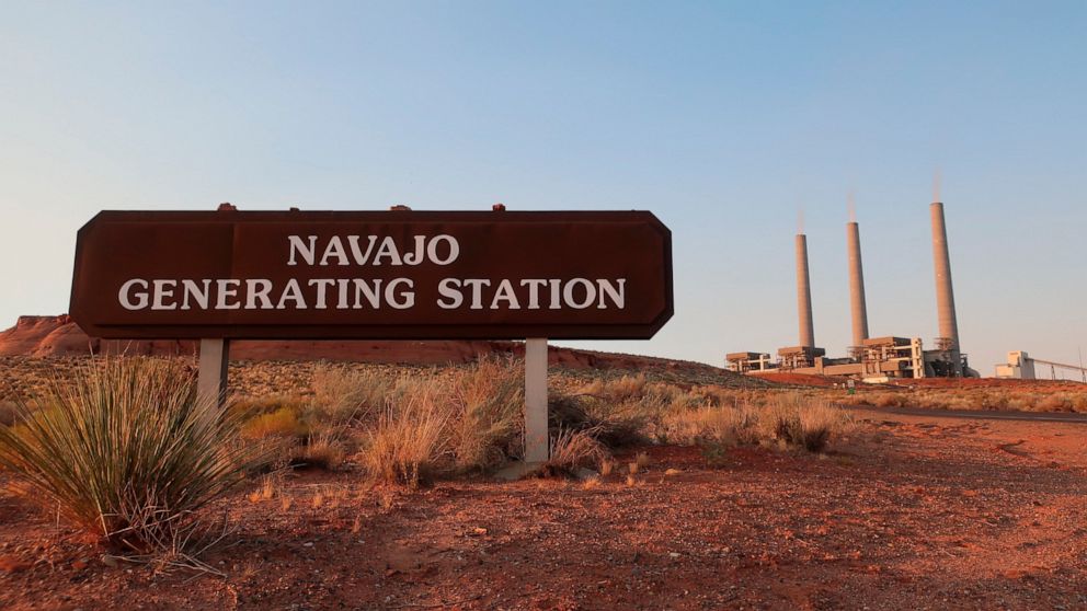 This Aug. 19, 2019, image shows the coal-fired Navajo Generating Station near Page, Ariz. The power plant will close before the year ends, upending the lives of hundreds of mostly Native American workers who mined coal, loaded it and played a part in