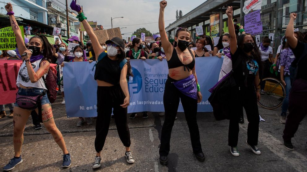 Women participate in a demonstration marking International Women's Day in downtown Guatemala City, Tuesday, March 8, 2022. (AP Photo/Oliver de Ros)