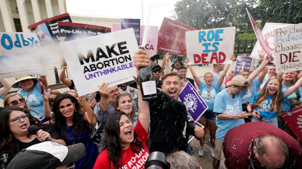 A celebration outside the Supreme Court, Friday, June 24, 2022, in Washington. The Supreme Court has ended constitutional protections for abortion that had been in place nearly 50 years — a decision by its conservative majority to overturn the court'