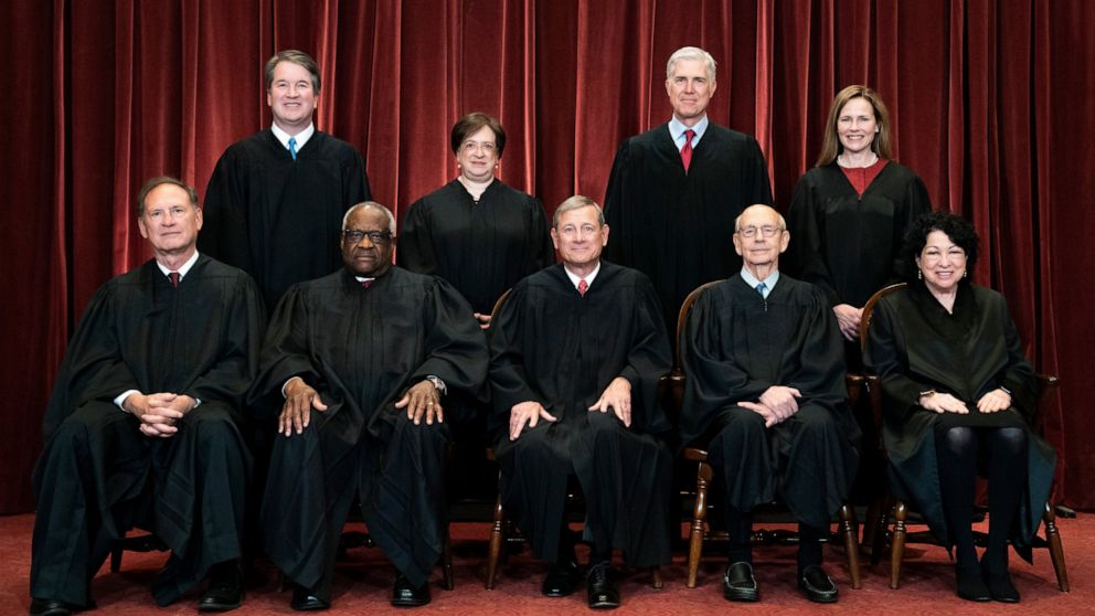 FILE - Members of the Supreme Court pose for a group photo at the Supreme Court in Washington, April 23, 2021. Seated from left are Associate Justice Samuel Alito, Associate Justice Clarence Thomas, Chief Justice John Roberts, Associate Justice Steph