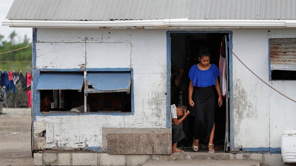 FILE - In this April 7, 2019, file photo, locals prepare to leave their house in Nuku'alofa, Tonga. The largest cluster of places without the coronavirus can be found in the scattered islands of the South Pacific. Tonga, Kiribati, Samoa, Micronesia a