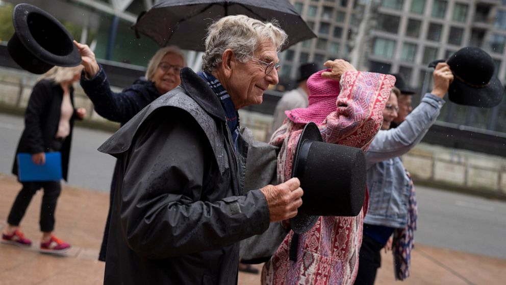 FILE - Campaigners took their hat off in a show of respect for people who took their own lives in The Hague, Netherlands, on Oct. 10, 2022. A Dutch court on Wednesday Dec. 14, 2022 upheld the Netherlands' ban on assisted suicide, in a setback for act