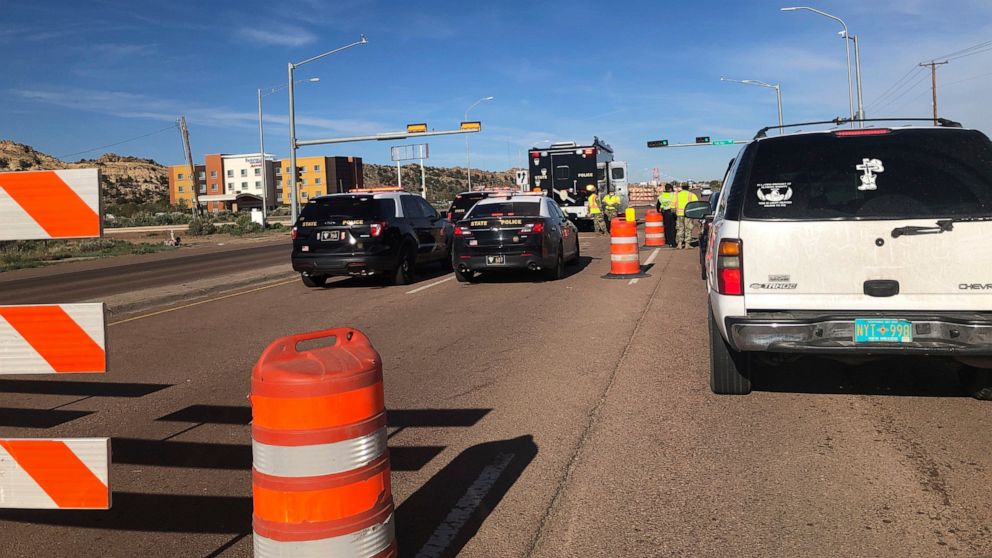 New Mexico State Police and National Guard soldiers are stationed at a roadblock off Interstate 40 on the eastern edge of Gallup, New Mexico, on Thursday, May 7, 2020. State and local authorities are weighing their options for containing the spread o