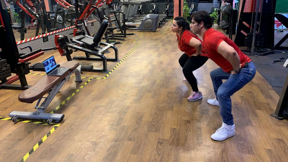 Bijender and Kanika Gautam, owners of the Ultra Bodies Fitness Studio, take online class from their closed Gyms on the outskirts of New Delhi, India, Thursday, June 10, 2021. Gyms were among the last types of venues allowed to reopen from the 2020 lo