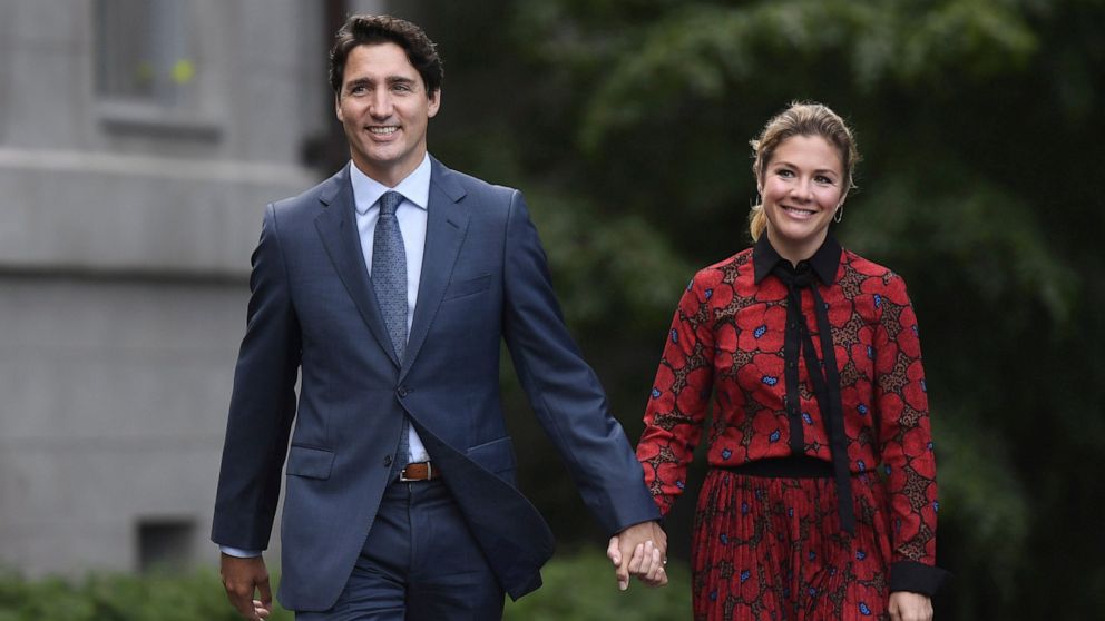 In this Wednesday, Sept. 11, 2019 photo, Canada's Prime Minister Justin Trudeau and his wife Sophie Gregoire Trudeau arrive at Rideau Hall in Ottawa, Ontario. Trudeau is quarantining himself at home after his wife exhibited flu-like symptoms. Trudeau