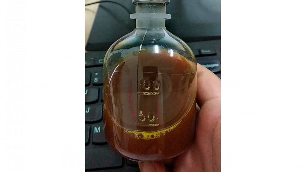 This August 2020, photo provided by a Uighur under quarantine shows a bottle of unidentified traditional Chinese medicine in Urumqi, China. As parts of the Xinjiang region in China's far northwest enters the 45th day of a second grueling lockdown due