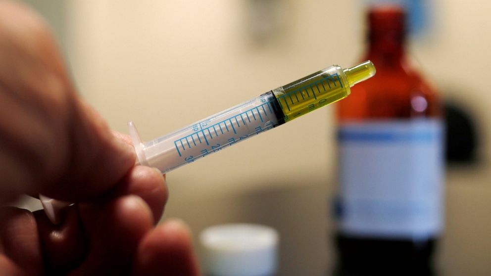 FILE - In this Nov. 6, 2017 file photo, a syringe with a dose of CBD oil is shown in a research laboratory in Fort Collins, Colo. CBD is a compound found in marijuana but doesn’t cause a high. On Tuesday, July 23, 2019, the Food and Drug Administrati