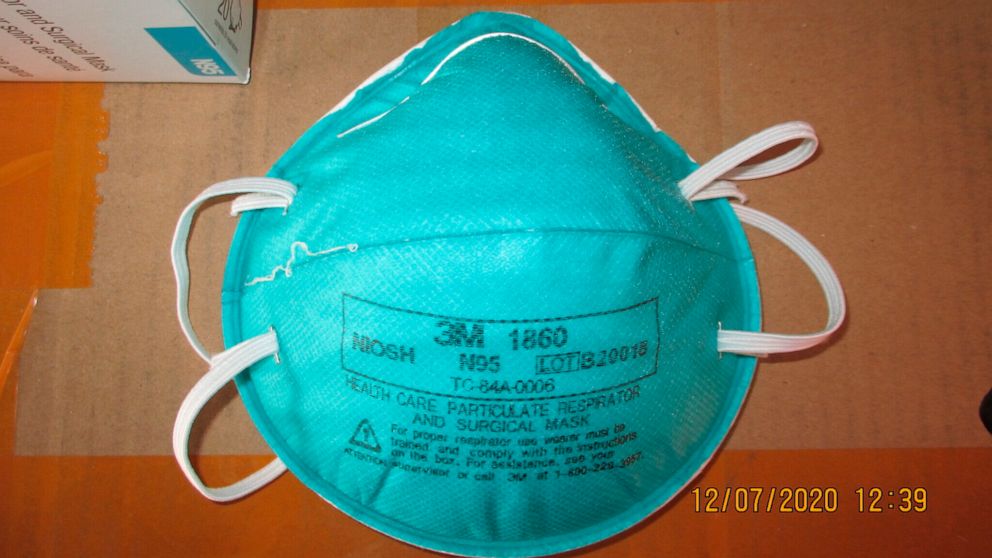This December 2020 image provided by U.S. Immigration and Customs Enforcement (ICE) shows a counterfeit N95 surgical mask that was seized by ICE and U.S. Customs and Border Protection. Federal investigators are probing a massive counterfeit N95 mask 