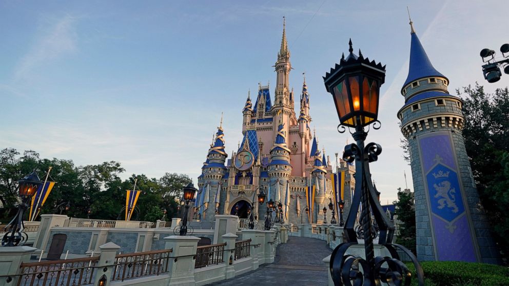 The Cinderella Castle at the Magic Kingdom at Walt Disney World is seen at the theme park, Aug. 30, 2021, in Lake Buena Vista, Fla. Disney has paused its policy requiring Florida-based employees to take the COVID-19 vaccine following new laws passed 