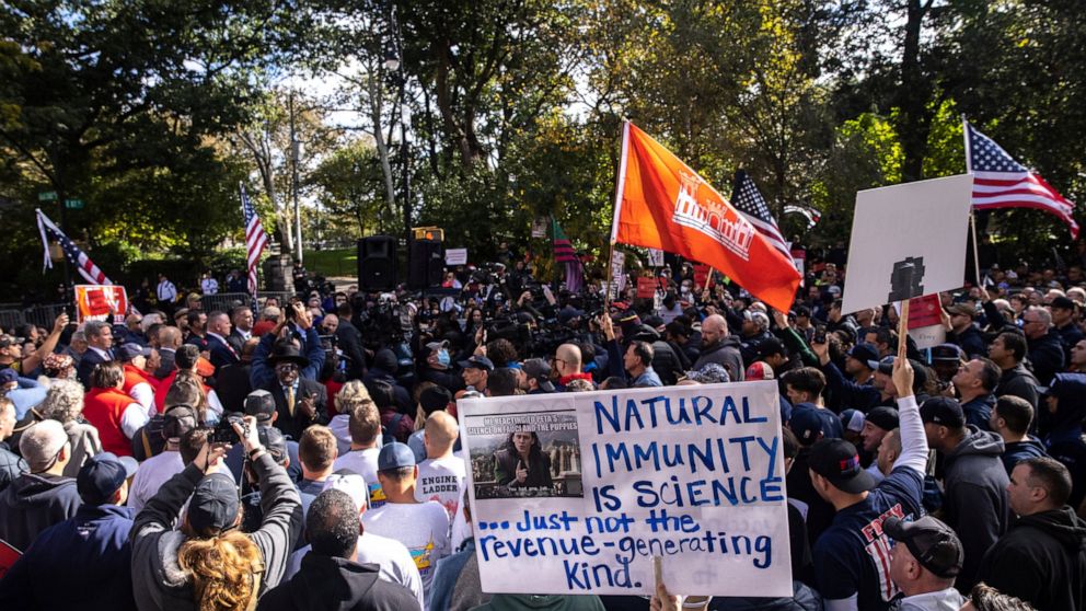 FILE - New York City municipal workers protest against the coming COVID-19 vaccine mandate for city workers, Thursday, Oct. 28, 2021, outside the Gracie Mansion Conservancy in New York. Millions of health care workers across the U.S. were supposed to