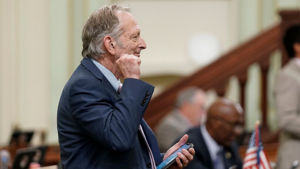 Assemblyman Bill Quirk, D-Hayward, pumps his fist after his bill was approved by the Assembly in Sacramento, Calif., Tuesday, Aug. 30, 2022. Quirk's bill would stop companies from punishing employees who use marijuana outside of work. Companies could