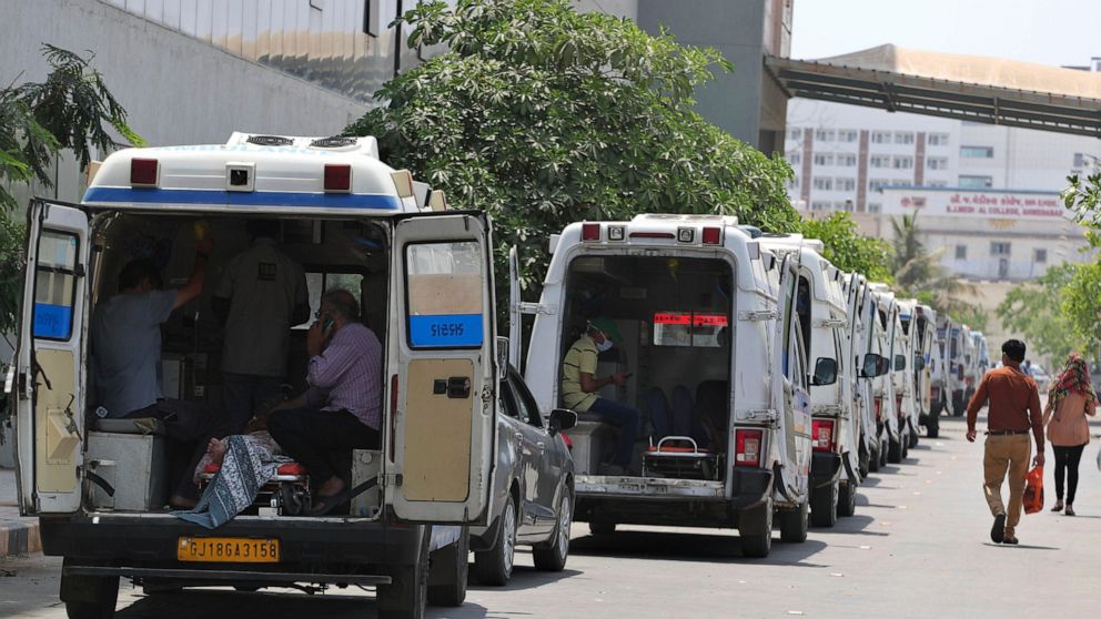 Ambulances carrying COVID-19 patients line up waiting for their turn to be attended at a dedicated COVID-19 government hospital in Ahmedabad, India, Thursday, April 22, 2021. India reported a global record of more than 314,000 new infections Thursday