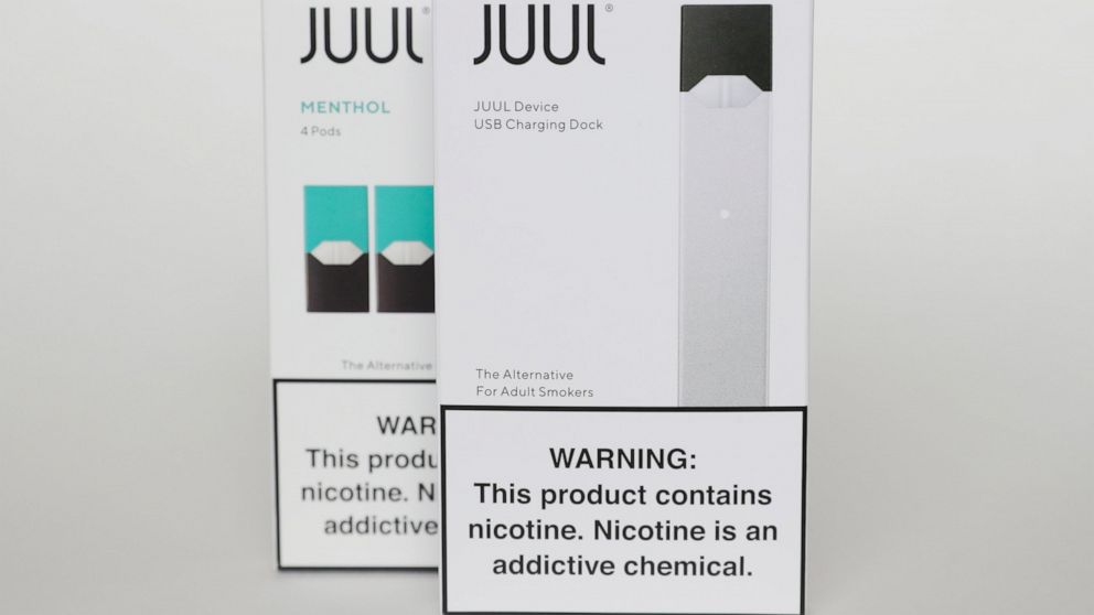 FILE - This Tuesday, Feb. 25, 2020 file photo shows packaging for an electronic cigarette and menthol pods from Juul Labs, in Pembroke Pines, Fla. Juul Labs Inc. will pay $40 million to North Carolina and take more action to prevent underage use and 